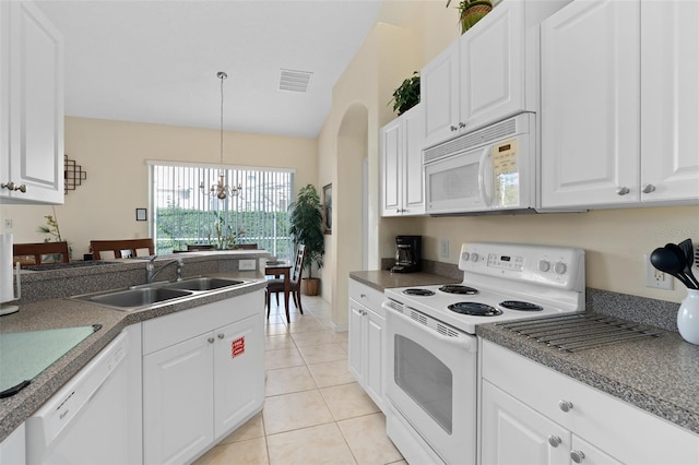 kitchen featuring white cabinetry, sink, a chandelier, white appliances, and decorative light fixtures