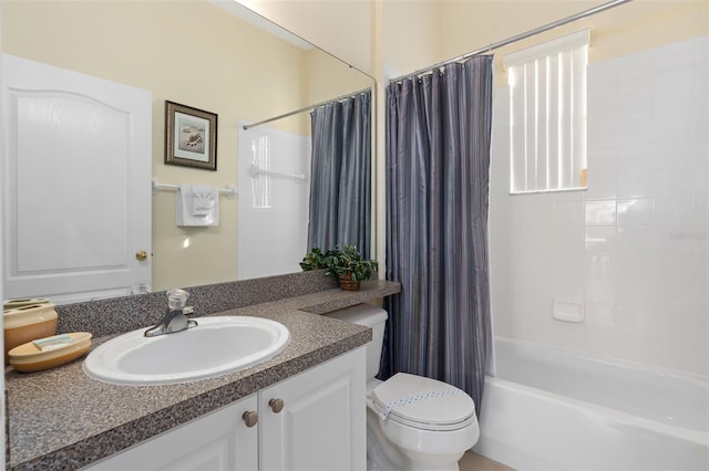 full bathroom with shower / bath combination with curtain, vanity, and toilet