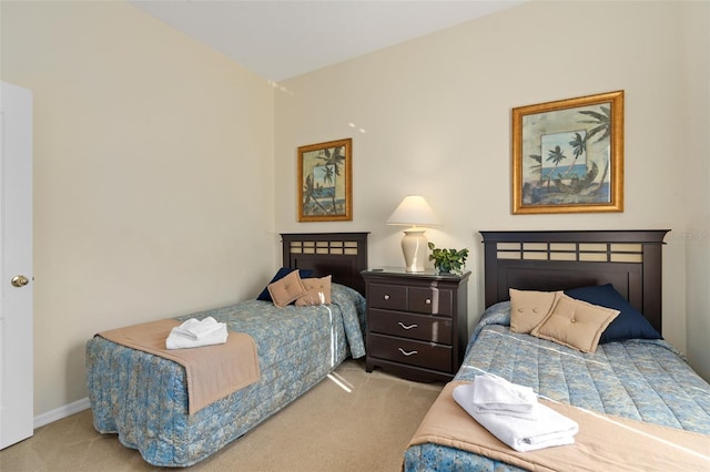 bedroom featuring light colored carpet