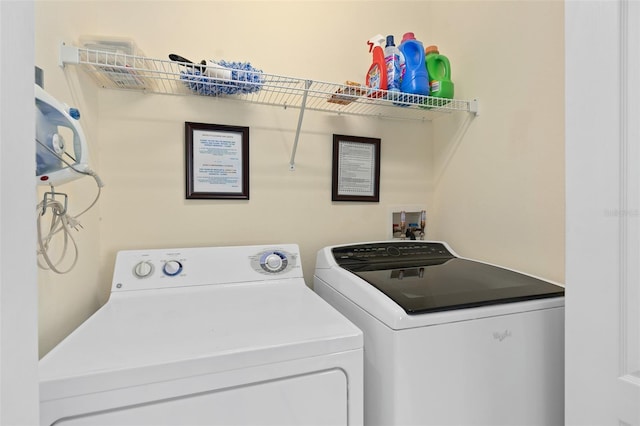 laundry room featuring washer and clothes dryer