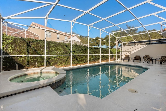 view of swimming pool with a lanai, an in ground hot tub, and a patio