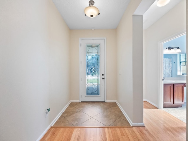 doorway to outside featuring light hardwood / wood-style flooring