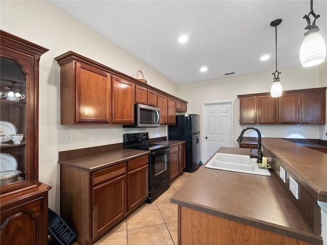 kitchen with black appliances, pendant lighting, light tile patterned floors, and sink