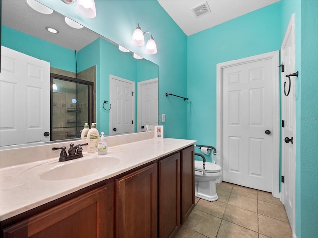 bathroom with tile patterned flooring, vanity, toilet, and walk in shower