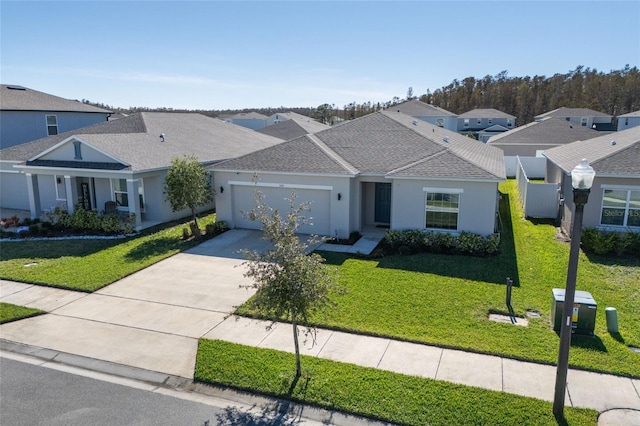 view of front of house featuring a garage and a front yard