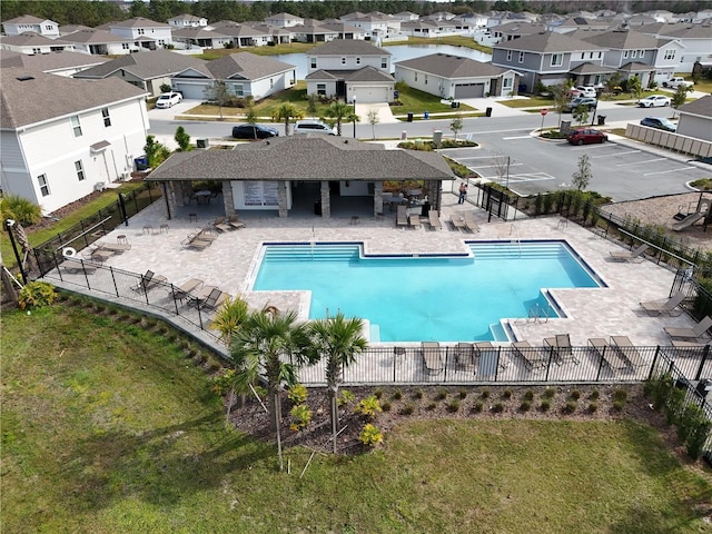 view of swimming pool featuring a patio and a lawn