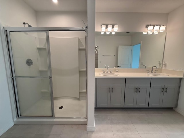 bathroom with walk in shower, tile patterned floors, and vanity