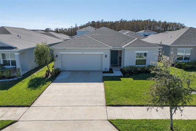 ranch-style house featuring a garage and a front yard