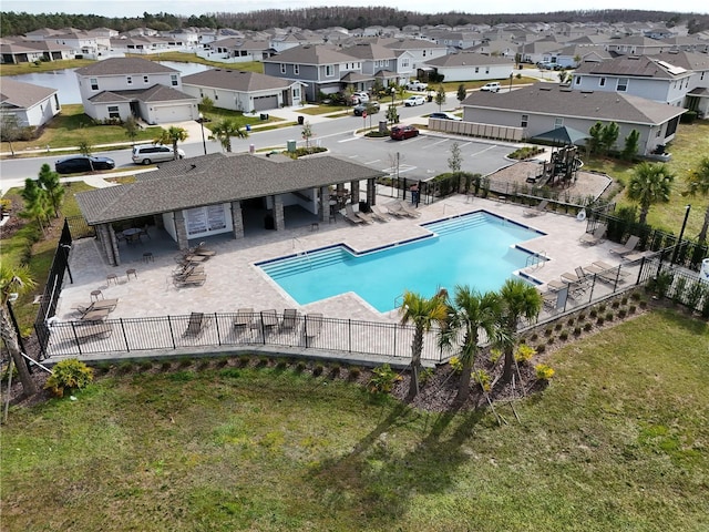 view of pool featuring a patio area and a lawn