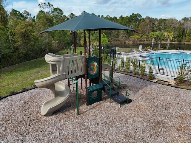 view of playground featuring a community pool