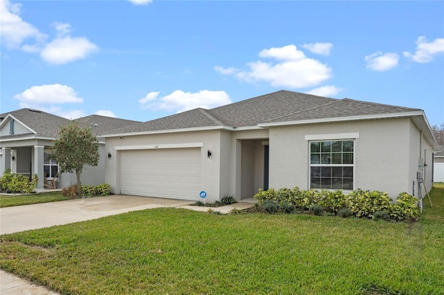 single story home featuring a garage and a front lawn