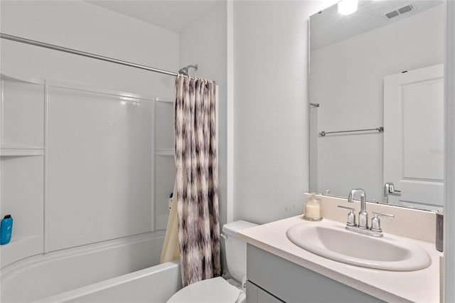 full bathroom featuring vanity, shower / bath combination with curtain, and toilet