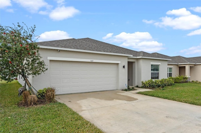 ranch-style house with a garage and a front yard