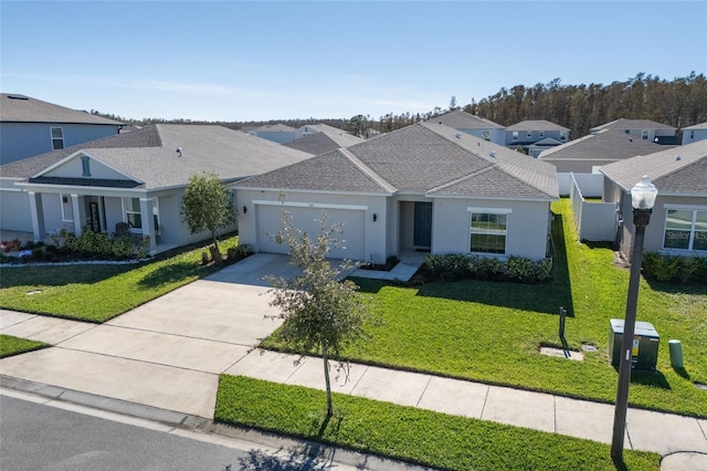 view of front of property with a garage and a front yard