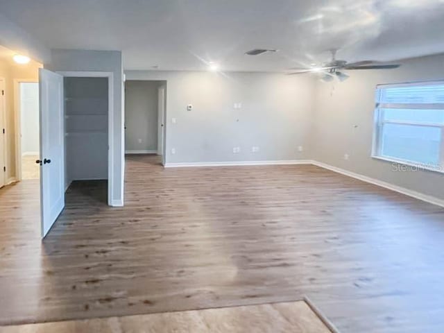 spare room featuring ceiling fan and hardwood / wood-style floors