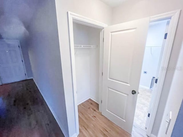 hallway featuring wood-type flooring