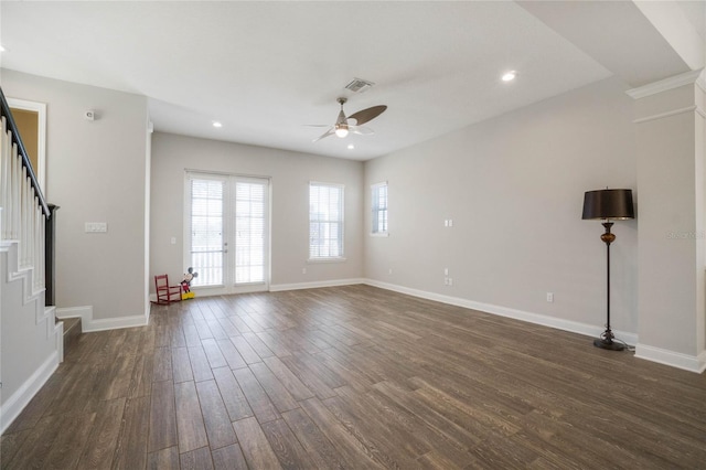 unfurnished living room with french doors, dark hardwood / wood-style flooring, and ceiling fan