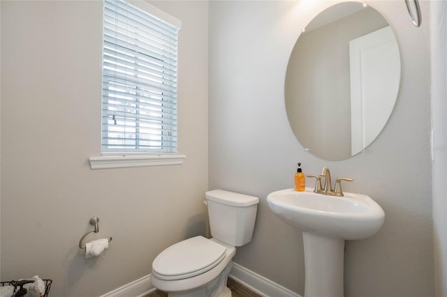 bathroom with toilet and sink