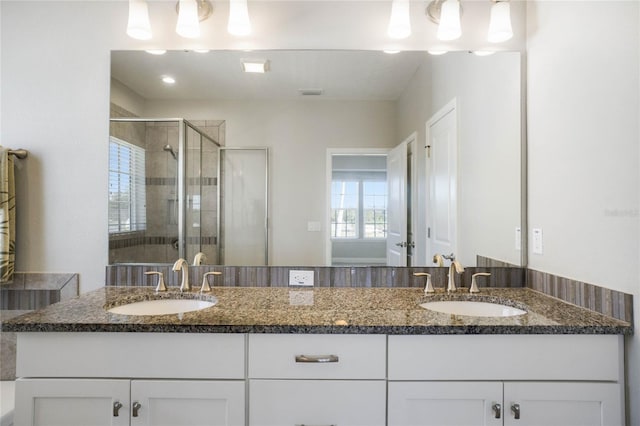 bathroom with vanity and walk in shower