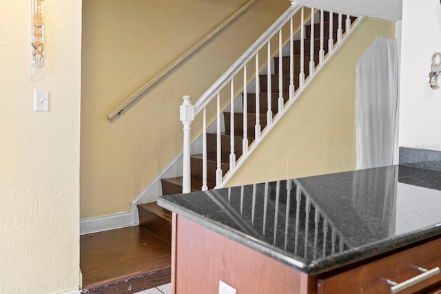 stairway featuring hardwood / wood-style flooring