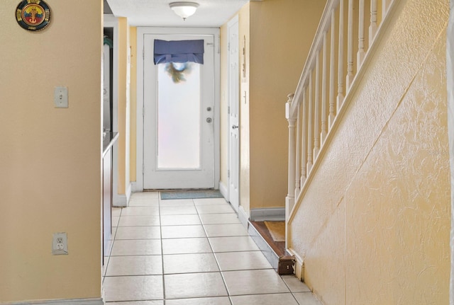 corridor with light tile patterned floors