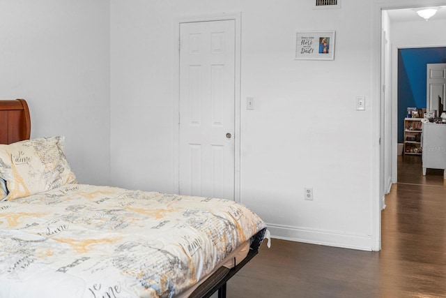 bedroom featuring dark hardwood / wood-style floors