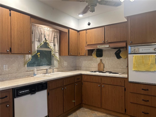 kitchen featuring ceiling fan, sink, white appliances, and decorative backsplash