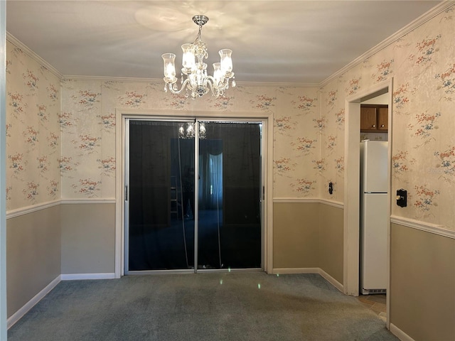 empty room featuring carpet floors and a notable chandelier