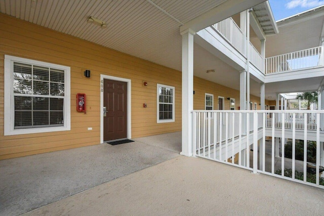 view of exterior entry with a porch