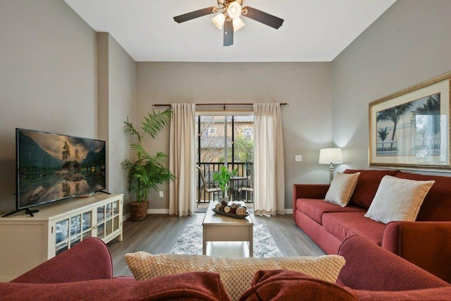 living room with ceiling fan and light hardwood / wood-style floors