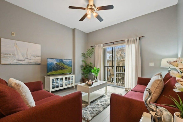 living room with hardwood / wood-style floors and ceiling fan