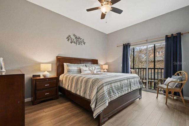 bedroom featuring ceiling fan, light hardwood / wood-style floors, and access to exterior