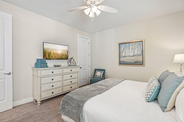 bedroom with ceiling fan and light colored carpet