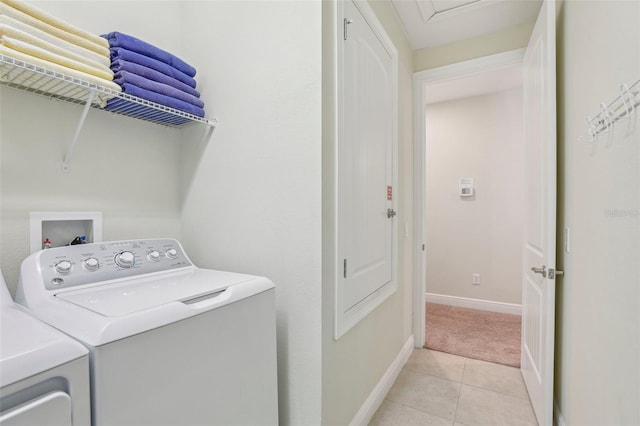 laundry room featuring light tile patterned floors and independent washer and dryer