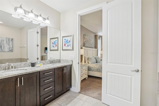 bathroom with tile patterned flooring and vanity