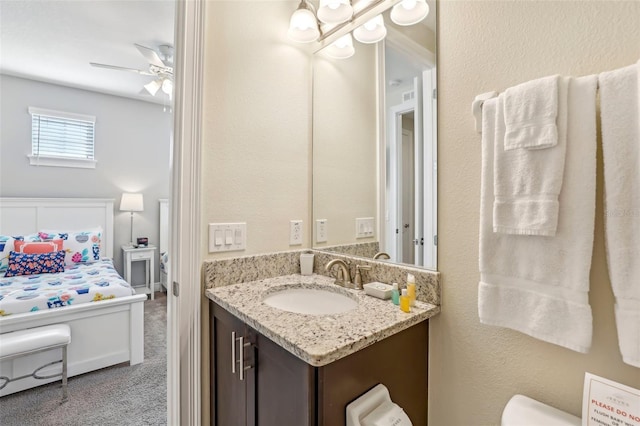 bathroom with ceiling fan and vanity