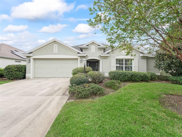 view of front of home with a garage and a front yard