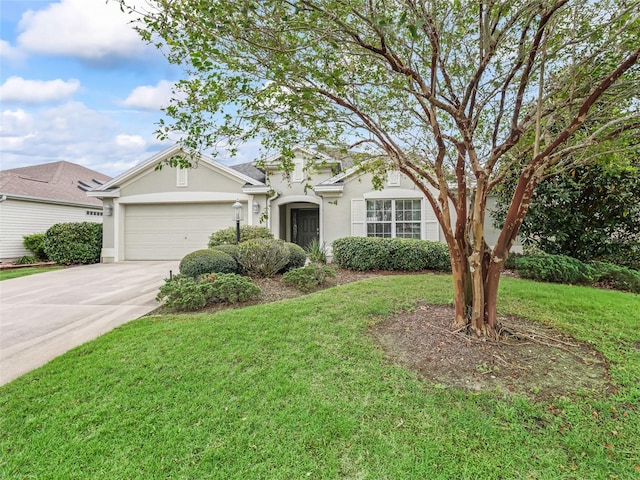 single story home featuring a garage and a front yard