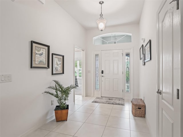 foyer entrance with light tile patterned flooring