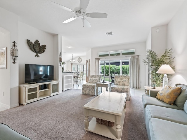 carpeted living room featuring ceiling fan