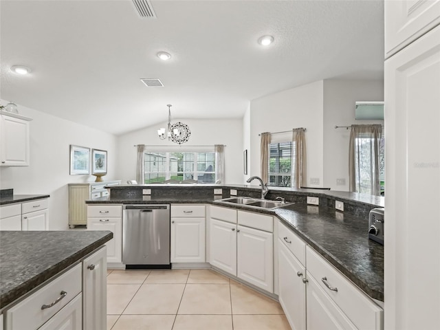 kitchen with dishwasher, white cabinets, sink, vaulted ceiling, and a notable chandelier