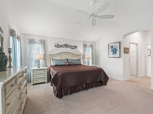 bedroom featuring light colored carpet and ceiling fan