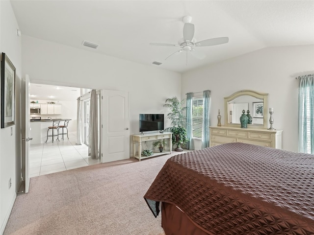 carpeted bedroom featuring ceiling fan and lofted ceiling