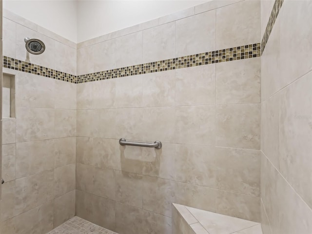 bathroom with tiled shower