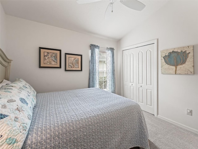 bedroom featuring carpet, a closet, ceiling fan, and lofted ceiling