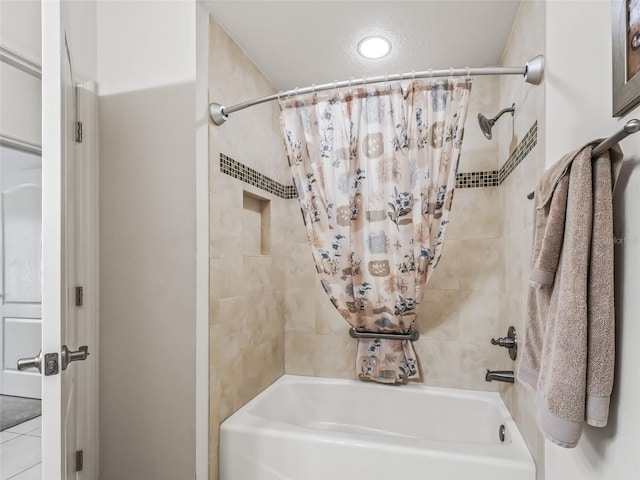 bathroom featuring tile patterned floors and shower / bath combo