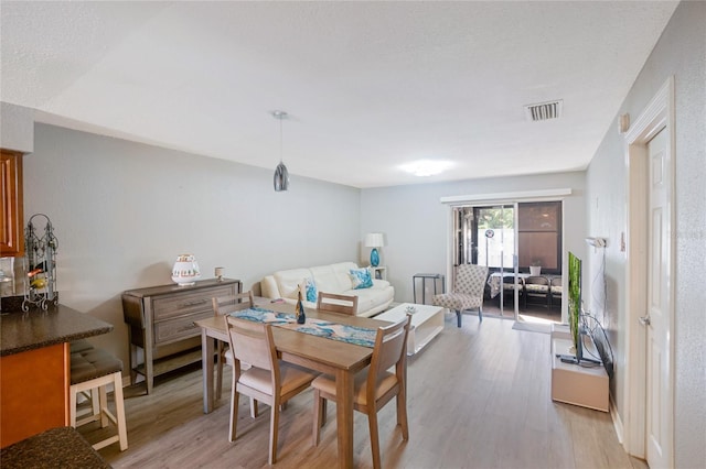 dining room with light hardwood / wood-style flooring