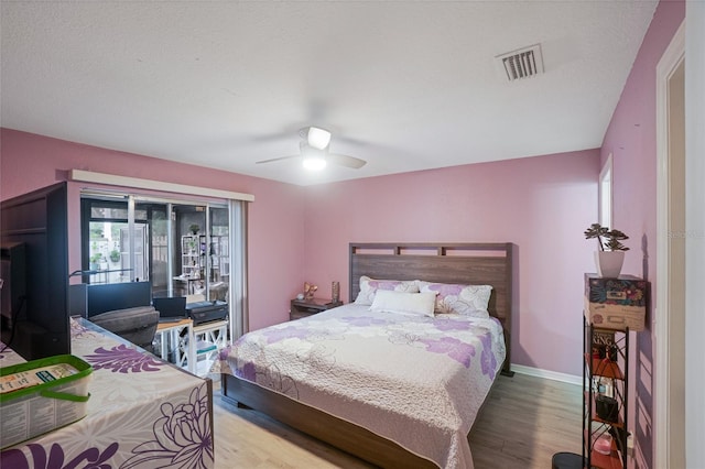 bedroom featuring wood-type flooring and ceiling fan