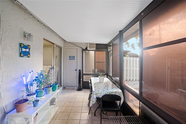 sunroom featuring a wall mounted AC