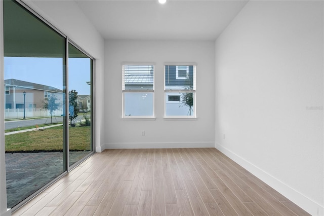 unfurnished room featuring light wood-type flooring